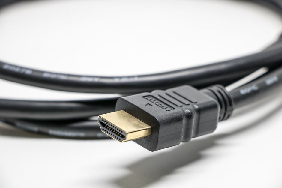 Streaming stick plugged into the back of a television