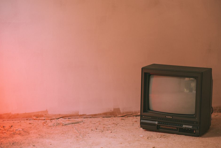 Small older television in a sparse room