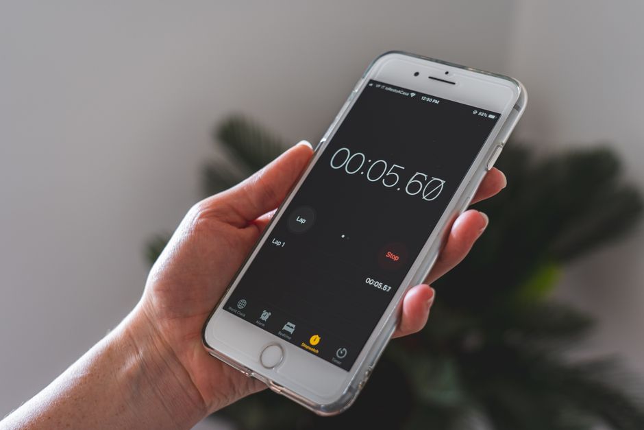 Stopwatch held in a hand
