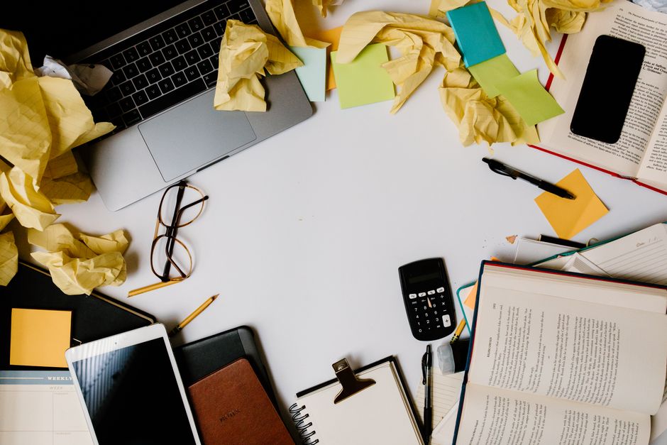 Cluttered desk with tangled cables