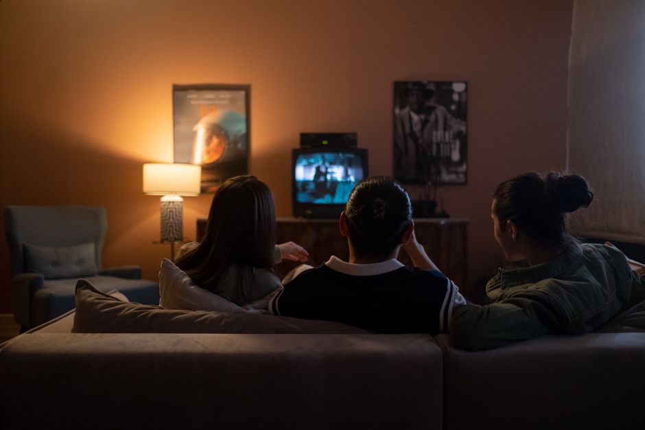 Living room lit by a lamp in the evening
