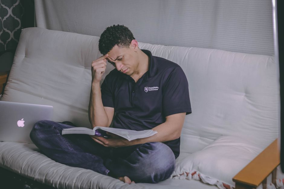 Person reading from a laptop at home