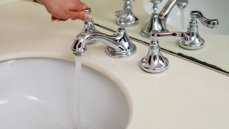 Water flowing from a bathroom sink tap