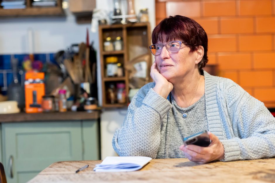 Homeowner thinking at a kitchen counter