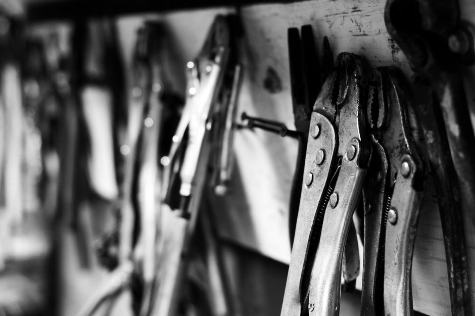 Plumbing tools laid out on a workbench
